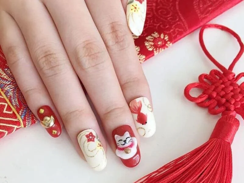 Mẫu nail Tết đơn giản mèo thần tài